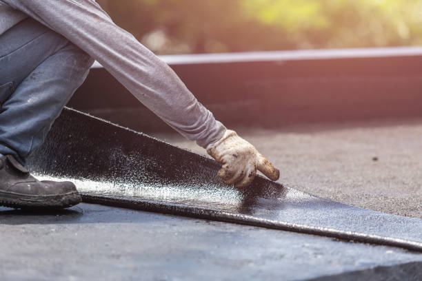 Professional Waterproofing technician working in Fairhope, AL
